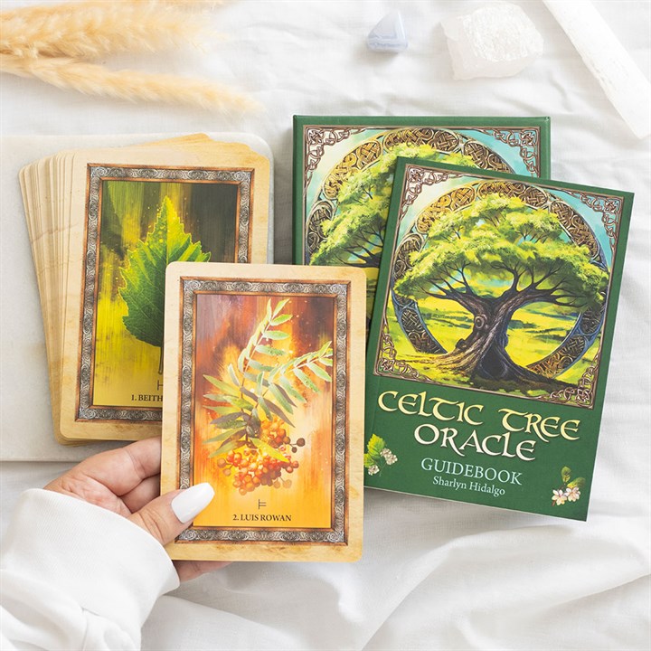 Discover the ancient wisdom of the Celtic Tree Oracle, a divination deck rooted in traditional Celtic tree mythology. These cards invite you to connect with the sacred spirits of trees, revered as guardians of timeless knowledge that nurture and sustain life. Through this deck, you’ll attune to the unique energies of each tree, deepening your bond with nature and inspiring journeys through enchanted forests. Rich in Celtic cosmology, the deck honours seasonal cycles and the sacredness of all living beings,