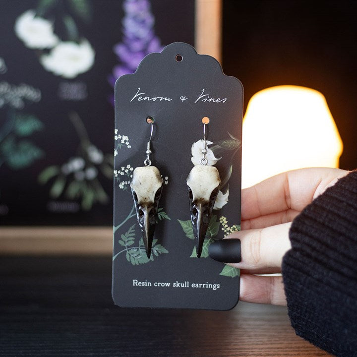 Complete your look with these statement resin crow skull dangle earrings. Light yet durable, they add an edgy and gothic touch to your style.