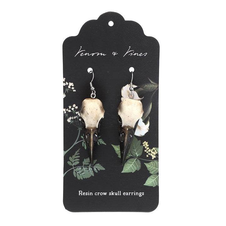 Complete your look with these statement resin crow skull dangle earrings. Light yet durable, they add an edgy and gothic touch to your style.