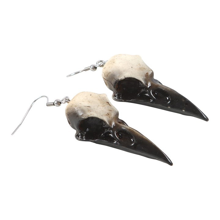 Complete your look with these statement resin crow skull dangle earrings. Light yet durable, they add an edgy and gothic touch to your style.