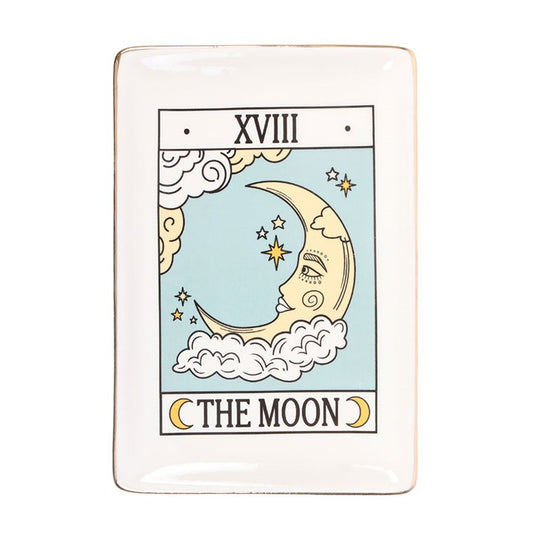 The Moon Vintage Tarot Trinket Dish is a captivating piece that blends mysticism with practicality. Crafted with an enchanting The Moon tarot card design and delicate gold edging, this dish invites the magic of the night into your space. Ideal for holding jewellery, keys, or small treasures, it keeps your cherished items safe while adding a mysterious charm to your desk, vanity, or side table. Embrace the energy of the moon and let this trinket dish be a daily reminder of intuition, dreams, and hidden wisdo