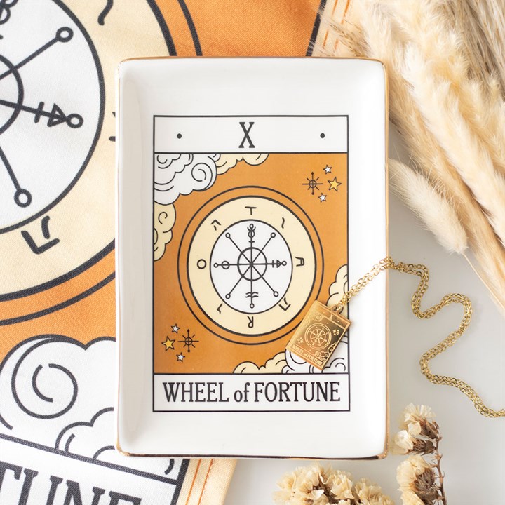 Tarot card featuring the 'Wheel of Fortune' with decorative elements on a light background.