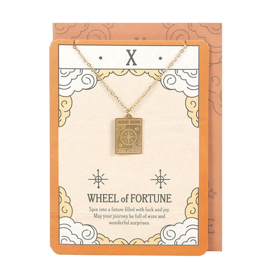 Necklace with 'Wheel of Fortune' pendant on a decorative card