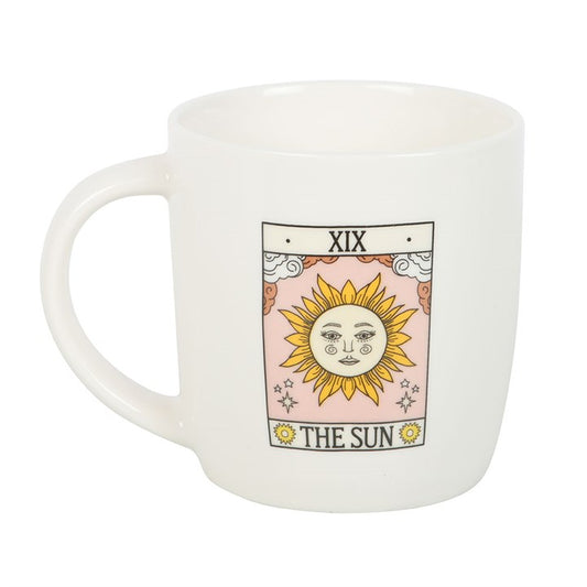 White mug with a sun design and 'The Sun' tarot card text on a white background