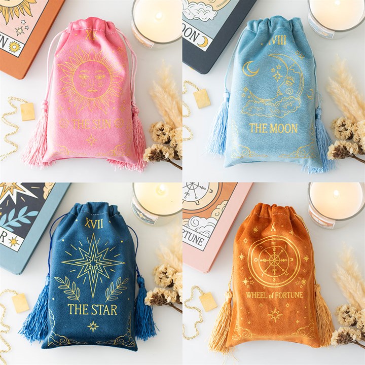 This set includes four velvet drawstring bags featuring The Sun (pink), The Moon (teal), The Wheel of Fortune (tan), and The Star (blue) tarot card designs. Ideal for storing tarot decks, crystals, or small accessories.