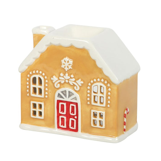Invoke the spirit of the season with this enchanting ceramic oil burner and wax warmer, shaped like a charming gingerbread house. Add your favorite festive essential oils or wax melts atop, light a single tealight below, and watch as a warm, magical glow releases delightful aromas that weave through your space. A bewitching touch to your seasonal sanctuary. Use only one tealight at a time, never leave it unattended, and let it cool completely before moving.