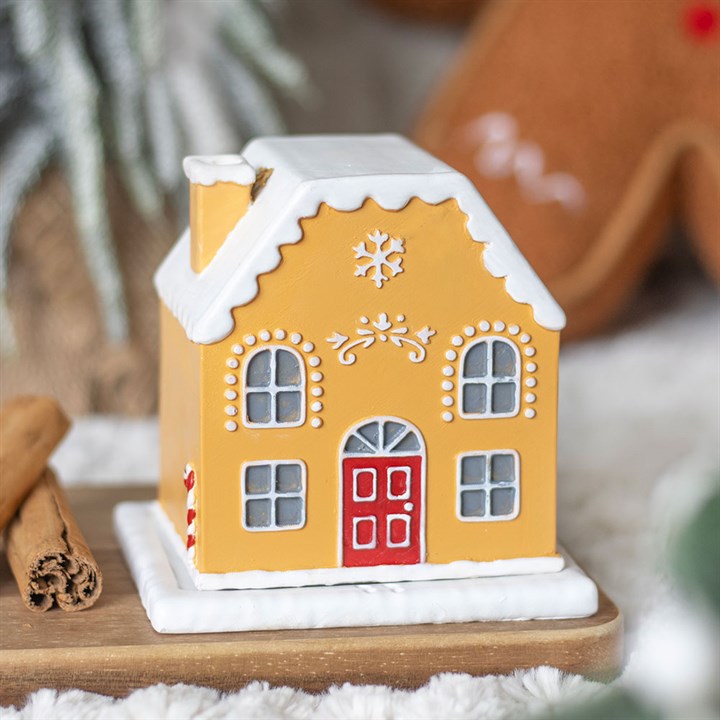 Embrace the enchanting spirit of the season with the Candy Cane Gingerbread House Incense Cone Holder. This mystical piece, shaped like a quaint gingerbread cottage, invites you to create a warm, magical ambiance as fragrant incense smoke curls softly through its chimney, like whispers from a winter fairy tale. Perfect for weaving festive charm and cozy energy into your sacred space, it transforms any room into a haven of seasonal wonder and comforting ritual. Let this delightful holder be your companion in
