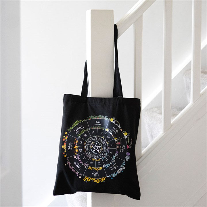 Carry the spirit of the seasons with this durable polycotton tote bag printed with a colourful Wheel of the Year design. Perfect for everyday use or as a reusable shopping bag for spiritual supplies and books.