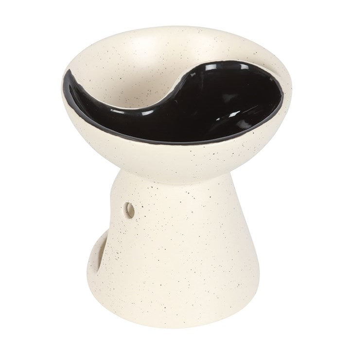 Ceramic oil burner with black interior on a white background