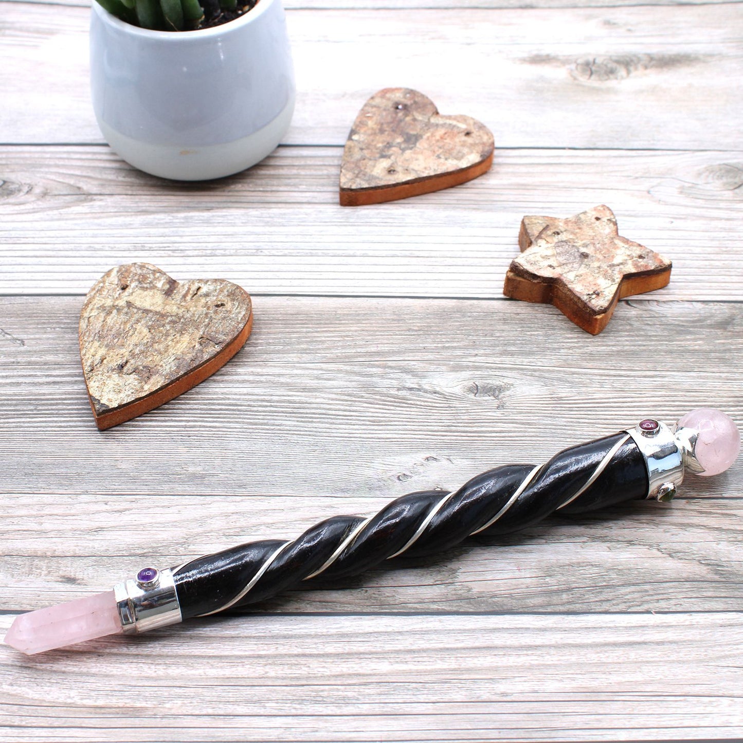Let love flow through every layer of your being with the Twisted Healing Wand – Silver Rose Quartz Sphere. Handcrafted with intention, this sacred tool features a spiraling form that channels energy gracefully and a silver-set Rose Quartz sphere that glows with the soft vibration of compassion and emotional healing.
Rose Quartz is the stone of unconditional love, soothing the heart and nurturing your connection to self, others, and the divine. Its gentle energy helps dissolve emotional wounds, restore trus