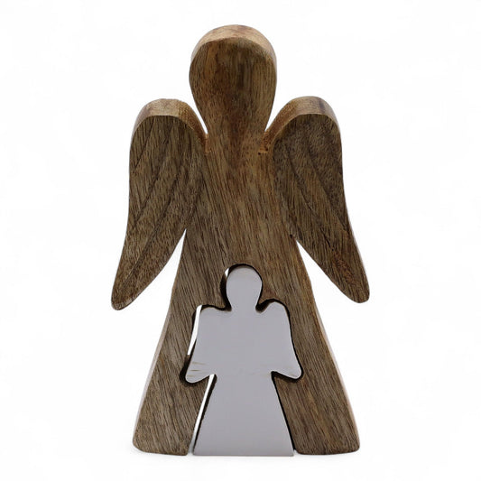 Carved from sacred mango wood and kissed with smooth white enamel, this serene angel figurine from thewitchesgarden captures a divine moment of compassion — a larger angel tenderly embracing a smaller one. It stands as a celestial symbol of guidance, remembrance, and spiritual protection, offering warmth and comfort to any space it graces.
Each piece is handcrafted in India, where skilled artisans merge natural wood with luminous enamel, creating a striking harmony between earth and light. Its gentle form
