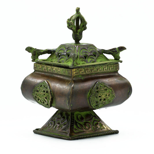 The four celestial guardians — dragon, phoenix, tiger, and tortoise — watch over the cardinal directions, embodying the elements and virtues that balance life and spirit. The Brass Verdigris Tibetan Burner – Four Symbols Square Standing Pot channels this sacred energy into your space, offering both spiritual resonance and artistic beauty.
Handcrafted in India, this square standing pot is made from high-quality brass and finished with a verdigris patina, giving it a timeless, aged appearance. Each celestial