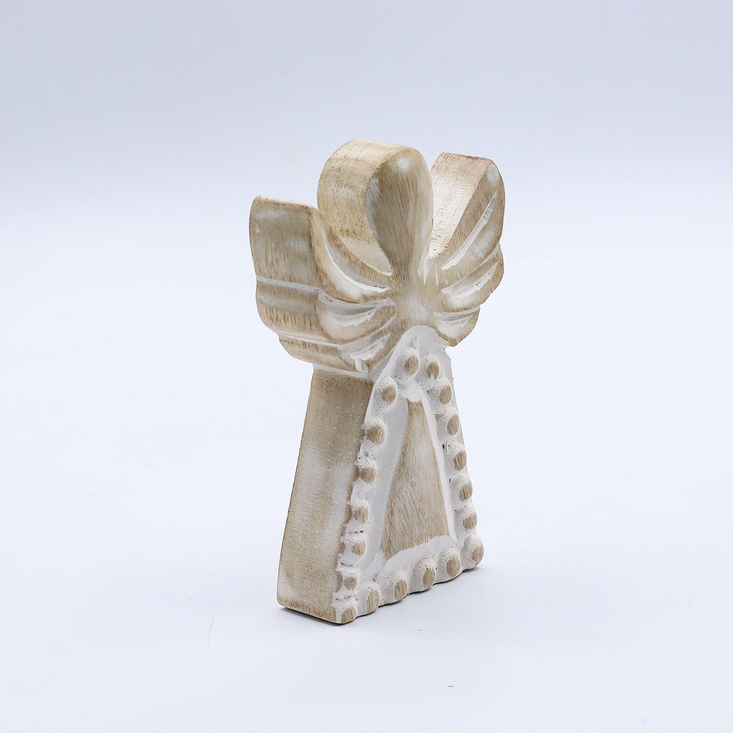 From the serene collection of thewitchesgarden, this Mango Wood Angel embodies simplicity, peace, and timeless charm. Hand-carved from natural mango wood and finished in a soft whitewash, it carries a soothing presence — a gentle reminder of protection and serenity.
Each angel is crafted in India, revealing the organic beauty of natural wood grain and the subtle variations that come with artisan craftsmanship. The distressed texture and soft detailing evoke a sense of rustic elegance, creating a piece that