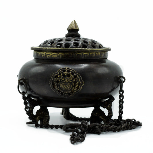 Invite sacred energy and timeless symbolism into your space with the Large Brass Tibetan Burner – Four Symbol Hanging Pot. Handcrafted in India, this impressive hanging incense pot carries the wisdom of the four celestial guardians — dragon, phoenix, tiger, and tortoise — representing the cardinal directions, elements, and virtues that bring balance and harmony.
Made from high-quality brass, this burner is durable yet refined, with intricate detailing that reflects centuries of Tibetan craftsmanship. Suspe