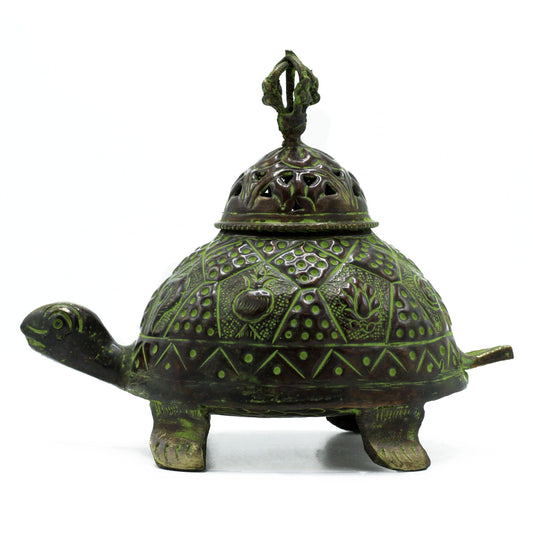 The Turtle has walked the earth since the beginning of time, carrying the wisdom of the ancestors and the grounding power of the earth itself. This Brass Verdigris Tibetan Turtle Incense Holder from Buddha-Buddha is more than a vessel for incense—it is a guardian spirit, a keeper of longevity, and a channel for sacred smoke.