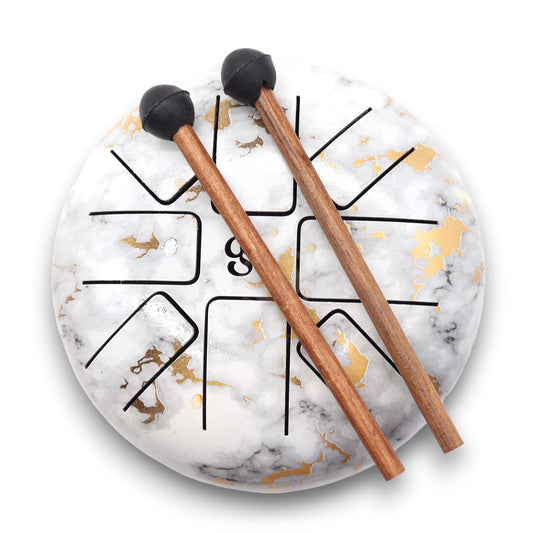 Rooted in stone and resonant with spirit, the Hapi Drum Marble Om – 18cm brings together sacred design and sonic harmony. With its marbled finish and engraved Om symbol, this drum channels the grounding energy of earth with the expansive stillness of sound.
Tuned to 8 gentle tones that support chakra balancing, mindfulness, and energy alignment, this drum is ideal for personal ritual, sound healing sessions, and spiritual exploration. The marble aesthetic evokes timelessness and inner strength, while the O