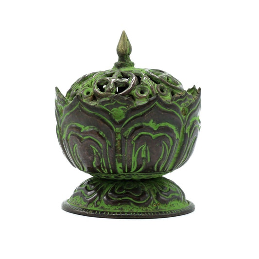 The lotus rises from the depths of still water, a timeless symbol of purity, awakening, and enlightenment. This Brass Verdigris Tibetan Incense Burner – Small Lotus carries that sacred meaning into your practice, offering both beauty and function.
Handcrafted in India by skilled artisans, the lotus design is shaped from high-quality brass and finished with a verdigris patina, giving the piece an antique, time-worn presence. The result is a burner that feels both ancient and alive, resonating with spiritual