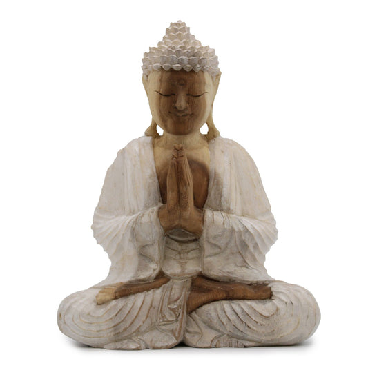 The hand extended in welcome is the open heart of compassion, inviting peace and harmony.
This 30cm Buddha statue is hand-carved from suar wood and finished with a soft whitewash, giving it a serene, timeless appearance. The subtle white tones accentuate the graceful lines of the robe, the peaceful expression, and the gentle hand gesture.
The Buddha is depicted in the Varada Mudra, the Gesture of Welcome and Compassion. With the right hand extended downward, palm open, this sacred position symbolizes gene