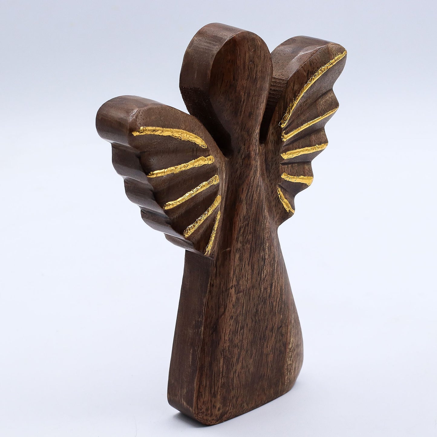 From the radiant collection of thewitchesgarden, this Large Mango Wood Angel shines with celestial grace and timeless artistry. Hand-carved from sustainable mango wood, the angel stands 19cm tall and is adorned with brilliant gold wings that shimmer softly in the light — a symbol of serenity, protection, and divine beauty.
Each piece is handmade in India, carrying unique wood grain patterns that celebrate its natural origins and the touch of the artisan’s hand. The golden detailing adds a warm, festive glo
