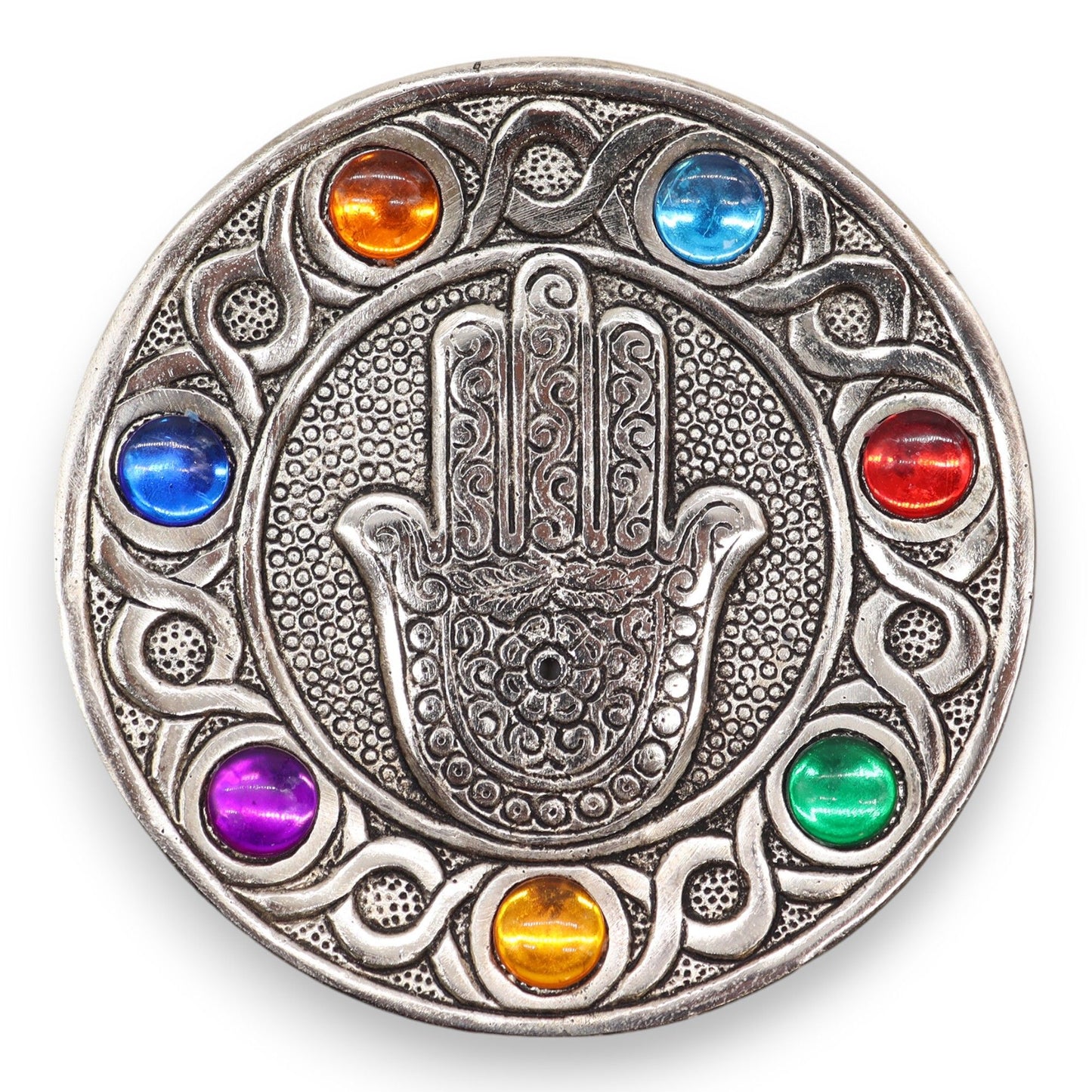  Measuring 11.5 cm, this piece is designed to accommodate standard incense sticks while adding a touch of elegance and meaning to any space.
Featuring the iconic Hamsa symbol, renowned for its protective qualities, this holder is beautifully adorned with the vibrant colours of the seven chakras. Each chakra represents a different energy centre, promoting balance and well-being, making it an ideal addition for those focused on mindfulness and spiritual practices.
