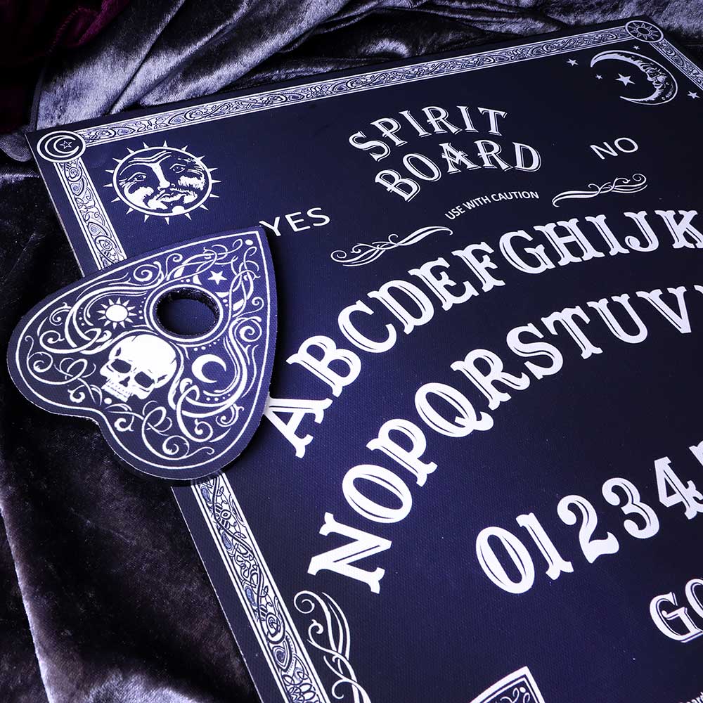 Spirit board with decorative elements on a dark background