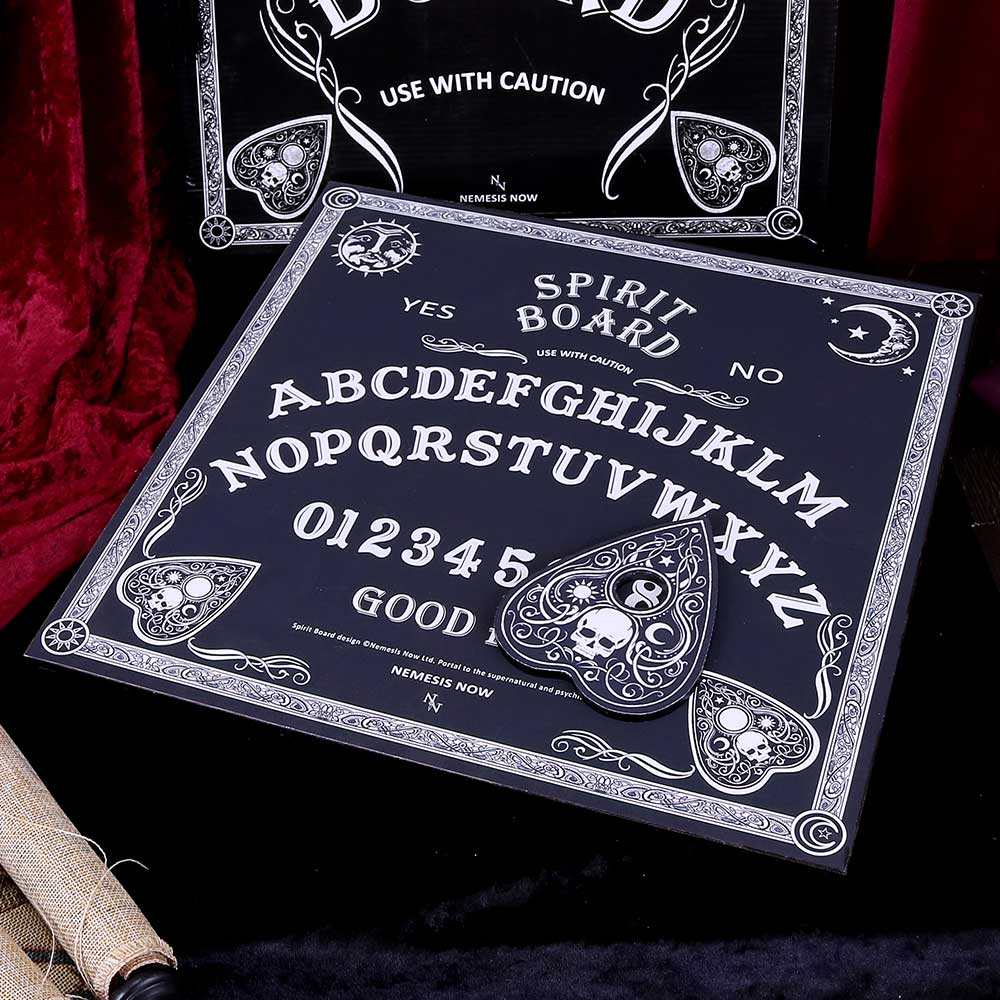 Ouija board with decorative border and text on a dark background
