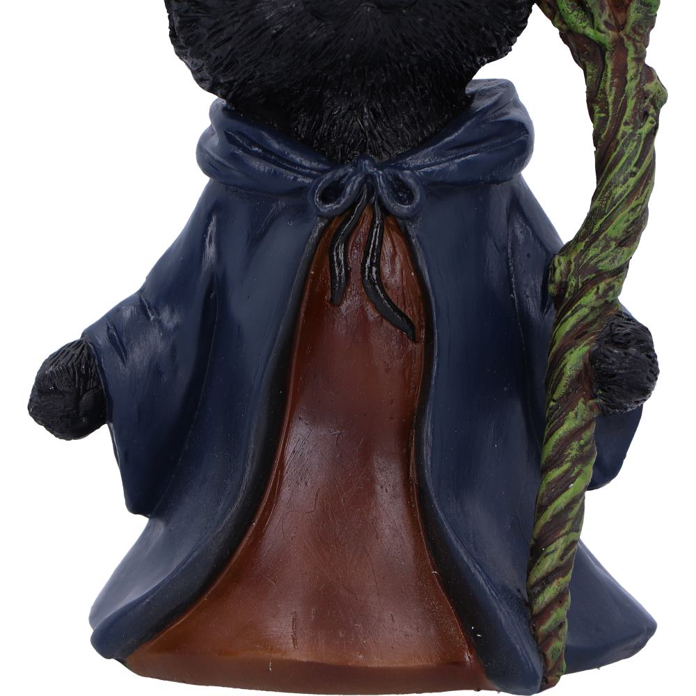 Black cat figurine wearing a blue cloak and holding a staff on a white background