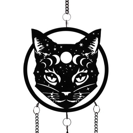 This Alchemy England hanging decoration is a striking piece of mystical decor. The black cat face adorned with moon phases and stars brings an air of enchantment to any space, accompanied by three magical chimes to amplify its charm.