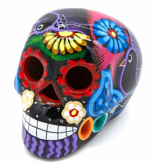 These fun ceramic sugar skull ornaments have been beautifully painted in bright colours and finished with a high shine glaze.  They are a popular item during Día de Los Muertos or Day of the Dead festivities, held in Mexico every November to celebrate welcoming the souls of their deceased relatives back for a time of food, drink and celebration.