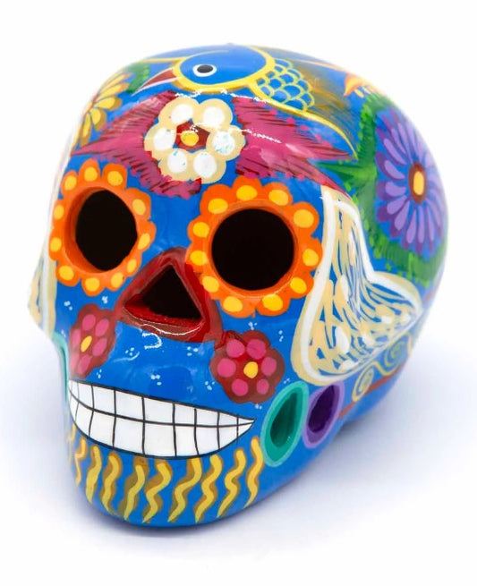 These fun ceramic sugar skull ornaments have been beautifully painted in bright colours and finished with a high shine glaze. They are a popular item during Día de Los Muertos or Day of the Dead festivities, held in Mexico every November to celebrate welcoming the souls of their deceased relatives back for a time of food, drink and celebration.