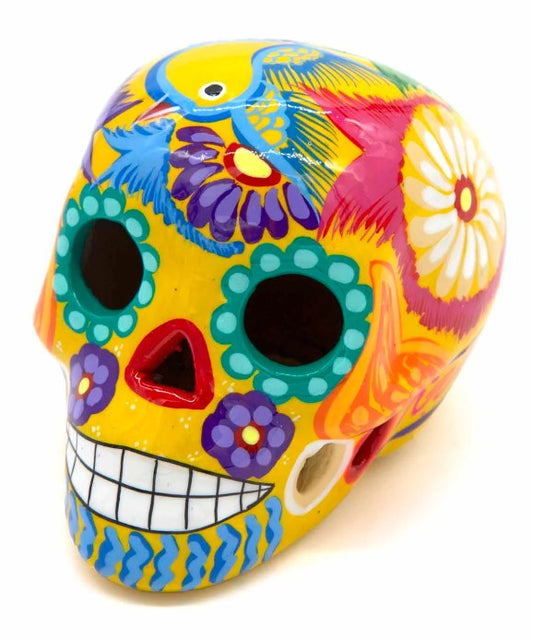 These fun ceramic sugar skull ornaments have been beautifully painted in bright colours and finished with a high shine glaze. They are a popular item during Día de Los Muertos or Day of the Dead festivities, held in Mexico every November to celebrate welcoming the souls of their deceased relatives back for a time of food, drink and celebration.