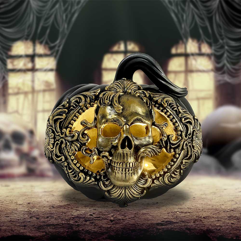 Bring a touch of decadent darkness to your autumn altar with the Baroque Harvest Pumpkin — a 20cm sculpted masterpiece for the witch with refined taste. Cast in the finest resin and finished in rich matte black with an opulent metallic gold front, this ornamental gourd is no humble harvest token.
Its ornate baroque styling evokes ancient feasts and gilded halls, where shadows danced with candlelight and magic was poured into every cup. Whether adorning your Samhain table, hearth, or sacred space, this pump