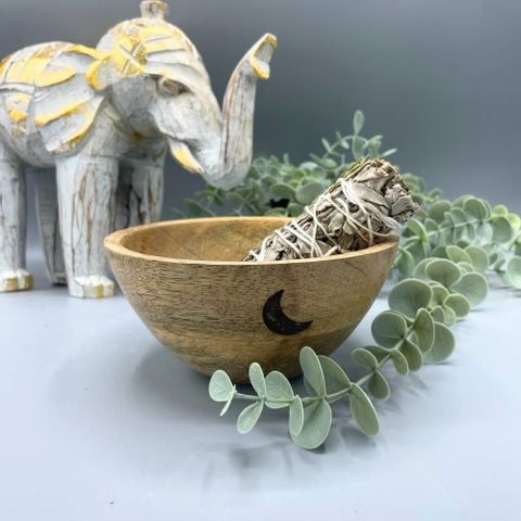 Embrace the sacred rhythm of the moon with this Wooden Smudge and Ritual Offerings Bowl – Three Moons, a beautifully handcrafted vessel that unites natural beauty with spiritual purpose. Measuring 13 x 7cm, this wooden bowl is adorned with the Triple Moon symbol, representing the waxing, full, and waning phases — the divine feminine, intuition, and cyclical transformation.
Perfect for holding smudging herbs, resins, crystals, or ritual offerings, its smooth, polished surface allows for effortless preparati