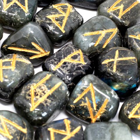Unlock ancient symbols and personal insight with our Labradorite Rune Set, beautifully hand-carved and stored in a soft pouch for safekeeping. This set includes 25 polished stones—24 etched with traditional Elder Futhark runes and one left blank, also known as the Odin stone.
Labradorite is a mystical semi-precious stone known for enhancing intuition, spiritual awareness, and psychic abilities. With its shimmering play of colours, it serves as a powerful tool for divination, protection, and self-discovery.