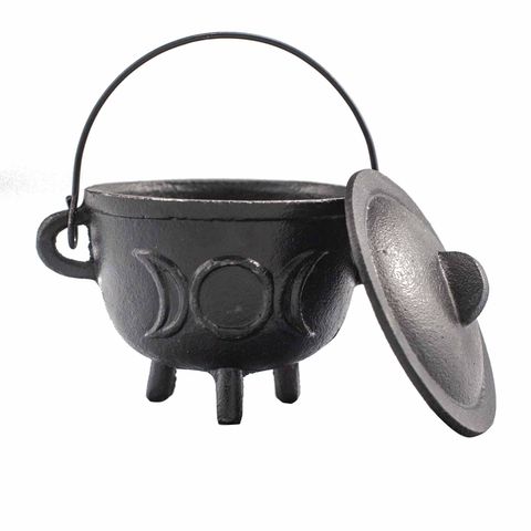 Our Cast Iron Cauldron adorned with the Triple Moon symbol, measuring 11x13cm, is a powerful companion for those seeking to deepen their connection with lunar magic. Emblazoned with the emblem of the Triple Goddess, it guides you through the sacred cycles of life and creation. Crafted from sturdy cast iron, this cauldron endures countless rituals, perfect for burning incense, herbs, and waxes during moonlit ceremonies. Embrace its mystical energy to enhance your spiritual practices. Remember to place it on