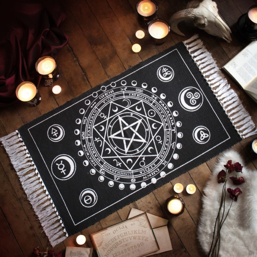 Enchant your altar with this handwoven Wiccan rug, featuring Sabbat symbols, moon phases & elements. Crafted in India from 100% cotton.