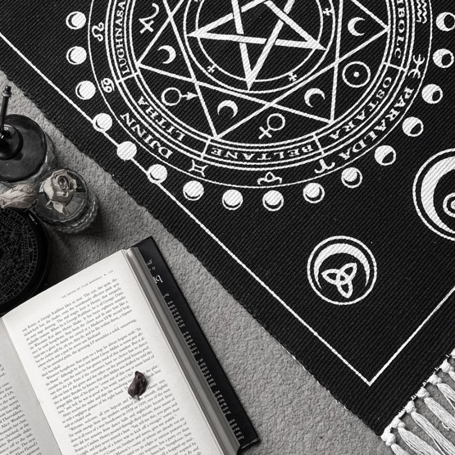 Enchant your altar with this handwoven Wiccan rug, featuring Sabbat symbols, moon phases & elements. Crafted in India from 100% cotton.
