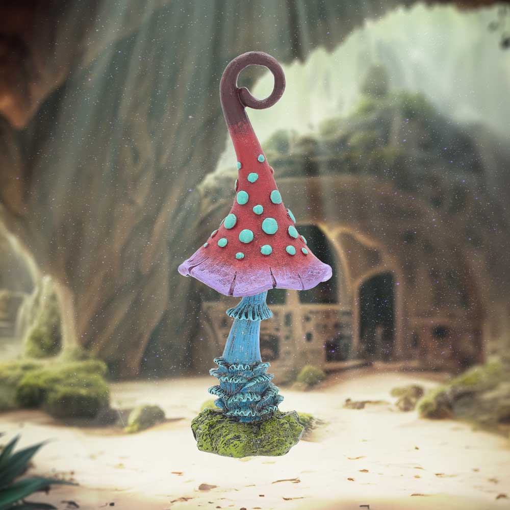 Fairy garden mushroom with a fantasy landscape in the background