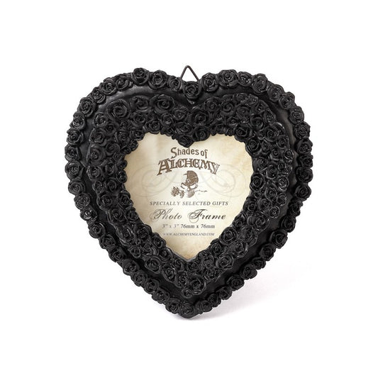 Alchemy Gothic Black Rose Heart Photo Frame – Shades of Alchemy
Embrace the beauty of darkness with this intricately crafted black rose heart photo frame by Alchemy Gothic. Part of the Shades of Alchemy collection, this piece is both elegant and romantic, ideal for capturing the memory of a loved one or adding a gothic flourish to your home décor.
Tiny black roses form a heart shape, creating a stunning border for your cherished photograph. Perfect for gothic boudoirs, altars, or as a meaningful gift for