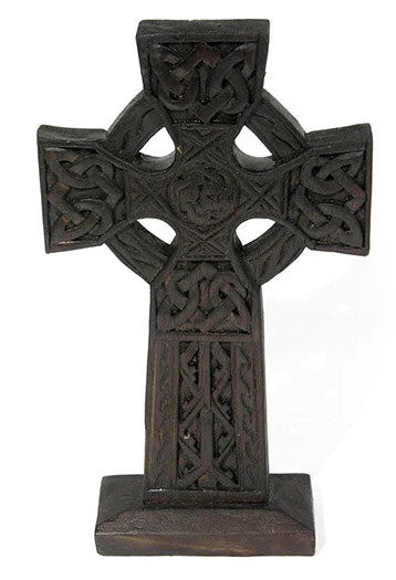This chunky yet lightweight wooden carved Celtic cross stands on solid, sturdy base.  This lovely little piece has carvings featuring Celtic style knots and etchings. Perfect for your mantlepiece or table.