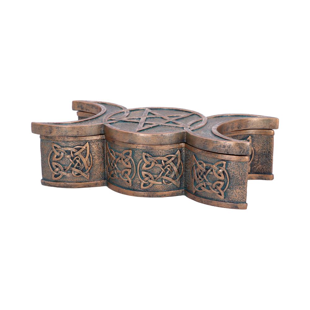 Bronze decorative item with Celtic knot designs on a white background