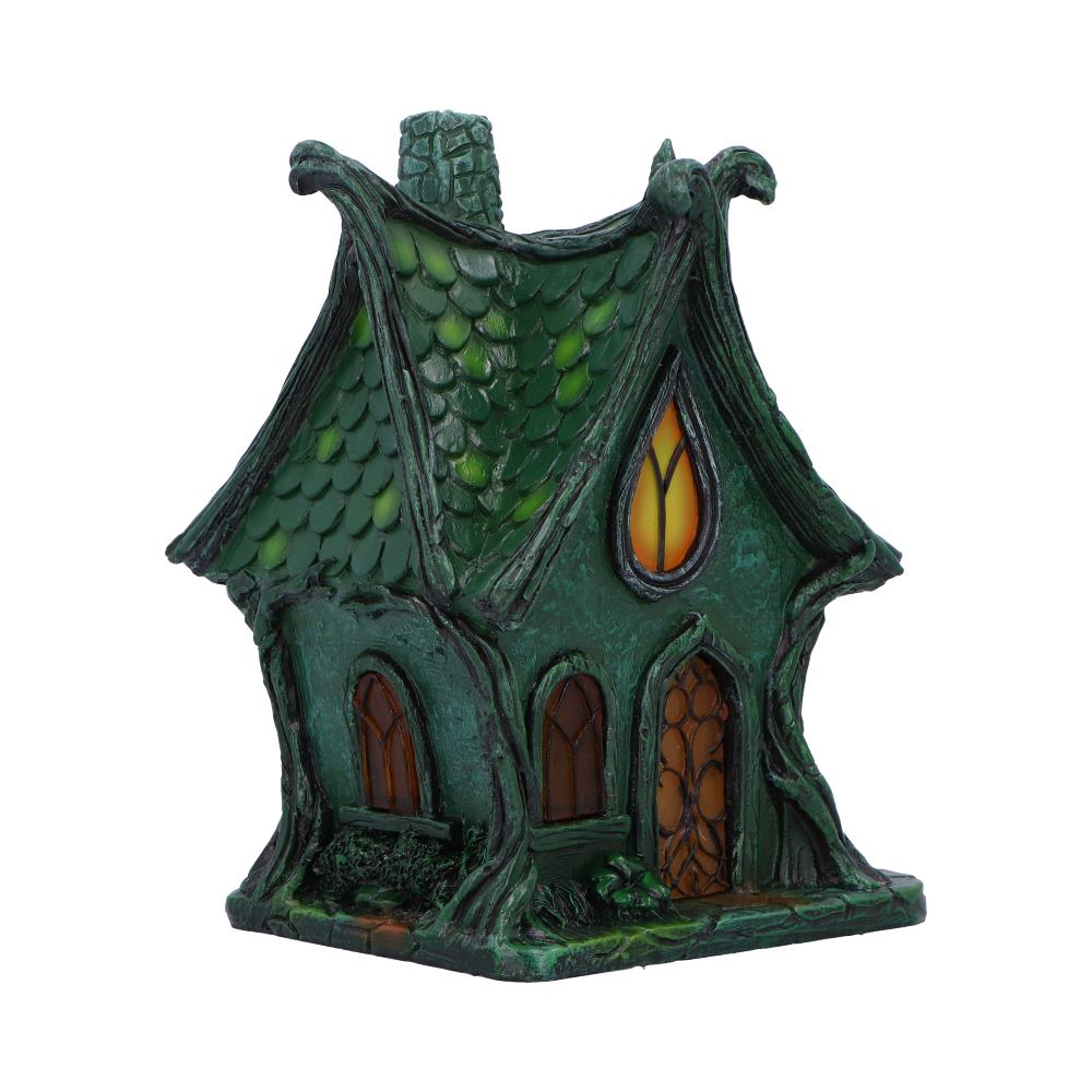 Deep within the shadowed glen lies the Evergreen Lodge — a fairy house aglow with ancient magic. Standing 17cm tall, this gothic-style cottage casts a gentle, mysterious light from within, thanks to its built-in LED illumination that awakens at twilight.
Crafted with care and charm, it features medieval-style arched windows, gnarled tree roots, and delicate s sculpted vines that wind up its stone-like walls. Every crevice whispers of old stories — of hidden folk and moonlit gatherings — making it the perfe