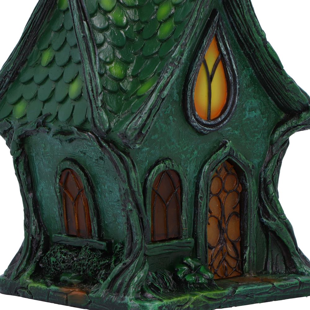 Deep within the shadowed glen lies the Evergreen Lodge — a fairy house aglow with ancient magic. Standing 17cm tall, this gothic-style cottage casts a gentle, mysterious light from within, thanks to its built-in LED illumination that awakens at twilight.
Crafted with care and charm, it features medieval-style arched windows, gnarled tree roots, and delicate s sculpted vines that wind up its stone-like walls. Every crevice whispers of old stories — of hidden folk and moonlit gatherings — making it the perfe