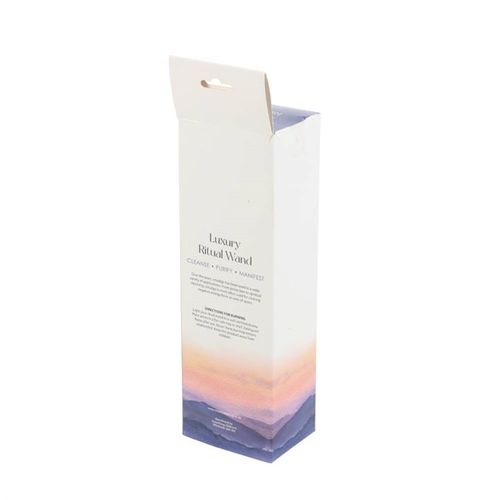 Packaging of a 'Luxury Ritual Wand' with gradient design on a white background