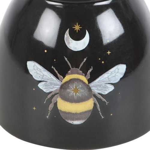 Welcome the magic of the forest into your sacred space with this Forest Bee Black Oil Burner, a mystical companion for aromatherapy and energetic alignment. Crafted with intention and adorned with celestial moon and star motifs, this enchanting piece radiates the grounded energy of the forest bee—an ancient symbol of unity, purpose, and divine timing.
Place your favorite essential oil or wax melt above a gentle tealight, and allow the soothing scents to raise your vibration and shift the energy of your hom