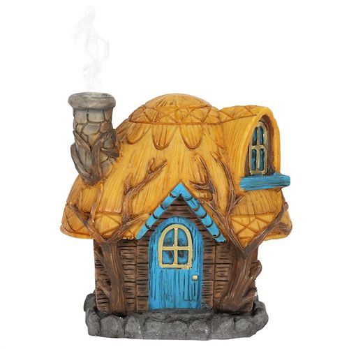 This charming 'Buttercup Cottage' incense cone holder resembles a quaint little house, perfect for adding a touch of magic to your space. Light an incense cone inside and see the smoke gently drift from the delicate fairy chimney. Crafted by the enchanting artist Lisa Parker. Dimensions: Height 12cm, Width 11.5cm, Depth 7cm. Packaged size: Height 13cm, Width 12cm, Depth 7.5cm.