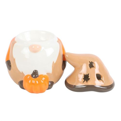 Ceramic dog-shaped salt and pepper shakers with a pumpkin on a white background