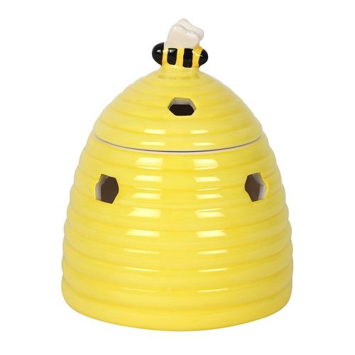 Infuse your sacred space with the radiant energy of the sun and the sweet hum of nature’s rhythm. Our Sunny Beehive Ceramic Oil Burner is more than just a beautiful décor piece—it’s a vessel for healing, transformation, and intention-setting.
Crafted with care from ceramic, this enchanting oil burner resembles a sun-kissed yellow beehive, crowned with a delicate bee that symbolizes community, diligence, and the sacred sweetness of life. The honeycomb-shaped cut-outs are not only magical in design but also