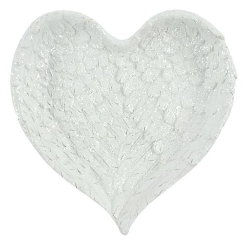 Heart-shaped object with a textured surface on a white background