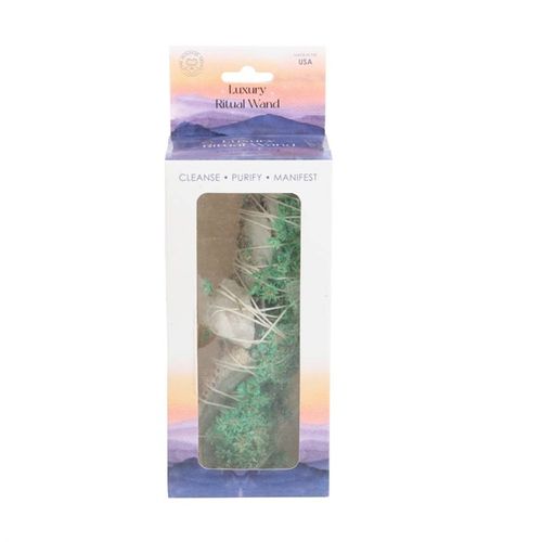 Packaged ritual wand with scenic background on a white background